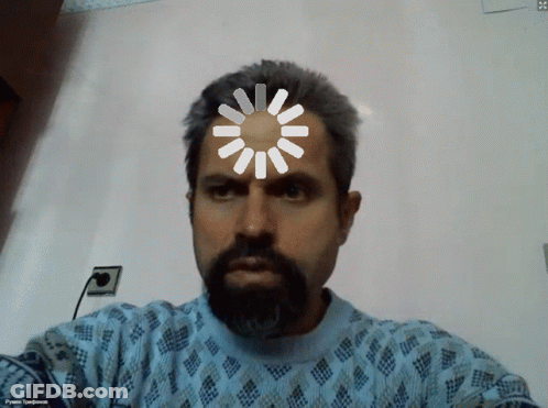 A Man With A Beard Is Wearing A Blue Sweater And Has A Spinning Wheel On His Head GIF