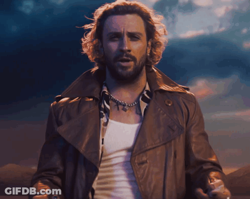 Man With Beard In Brown Leather Jacket And White Tank Top GIF