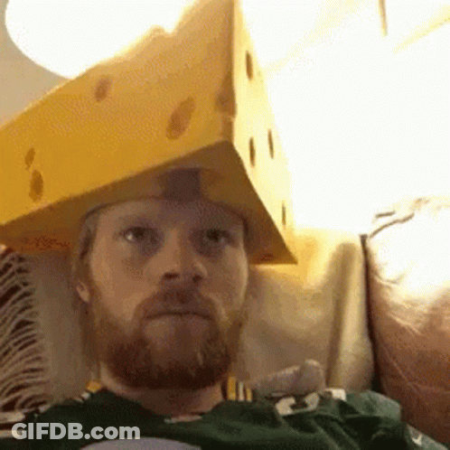 A Man With A Beard Is Wearing A Cardboard Box On His Head GIF