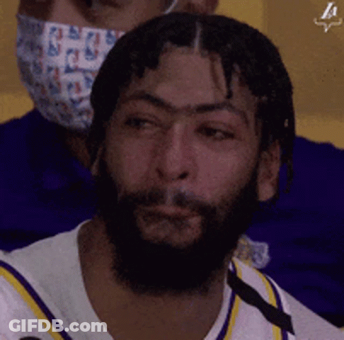 A Man With A Beard Is Wearing A Face Mask GIF