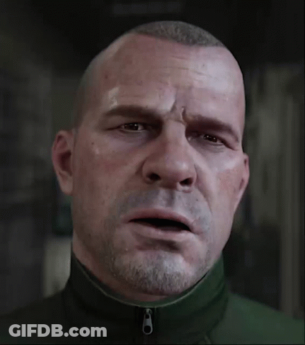 A Man With A Beard Is Wearing A Green Jacket With A Zipper On The Front GIF