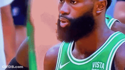 A Man With A Beard Is Wearing A Green Jersey That Says Vista On It GIF