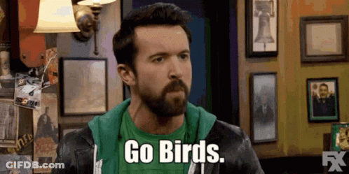 A Man With A Beard Is Wearing A Green Shirt And A Leather Jacket And Says `` Go Birds '' . GIF