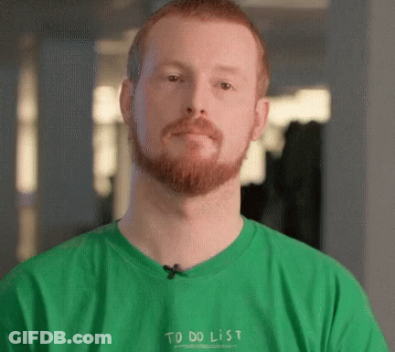 A Man With A Beard Is Wearing A Green T-Shirt That Says To Do List GIF