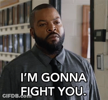 A Man With A Beard Is Wearing A Grey Shirt And Tie And Says I 'M Gonna Fight You . GIF