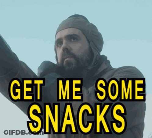 A Man With A Beard Is Wearing A Hat And A Jacket And Says Get Me Some Snacks GIF
