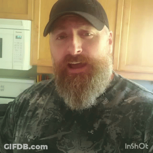 A Man With A Beard Is Wearing A Hat And A Shirt That Says Inshot On It GIF