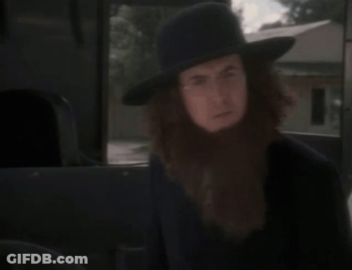 A Man With A Beard Is Wearing A Hat GIF