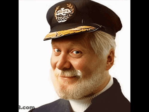 A Man With A Beard Is Wearing A Hat That Says Captain On It GIF