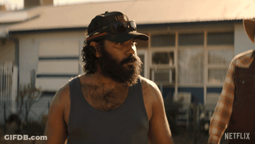 A Man With A Beard Is Wearing A Hat That Says Life GIF