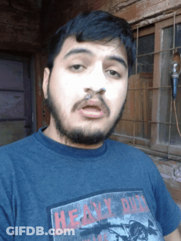 A Man With A Beard Is Wearing A Heavy Duty T-Shirt GIF