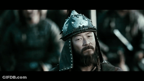 A Man With A Beard Is Wearing A Helmet GIF