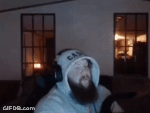 A Man With A Beard Is Wearing A Hoodie That Says Ca On It GIF