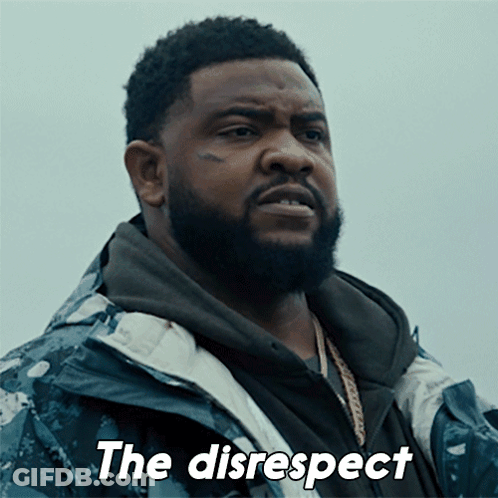 A Man With A Beard Is Wearing A Jacket That Says The Disrespect On It GIF