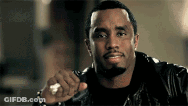 A Man With A Beard Is Wearing A Leather Jacket And Holding A Ring In His Hand . GIF