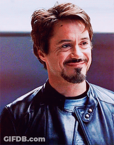 A Man With A Beard Is Wearing A Leather Jacket GIF