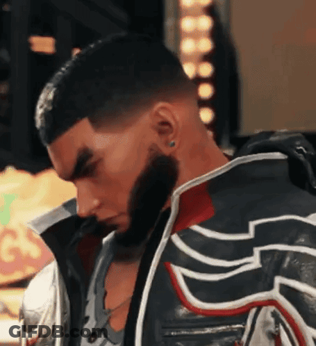 A Man With A Beard Is Wearing A Leather Jacket With A Red White And Blue Design On It . GIF