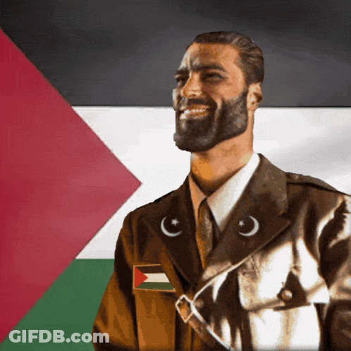 A Man With A Beard Is Wearing A Military Uniform With A Flag Patch GIF