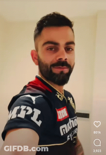 A Man With A Beard Is Wearing A Mpl Shirt GIF