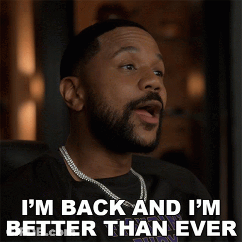 A Man With A Beard Is Wearing A Necklace And Says I 'M Back And I 'M Better Than Ever GIF