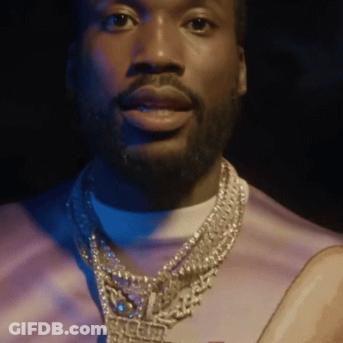 A Man With A Beard Is Wearing A Necklace That Says Ice Cube GIF