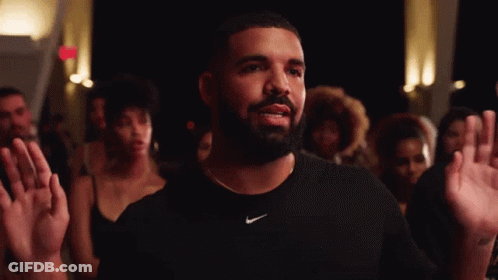 A Man With A Beard Is Wearing A Nike Shirt GIF