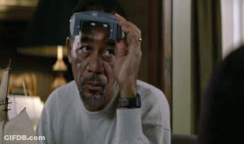 A Man With A Beard Is Wearing A Pair Of Glasses On His Head . GIF