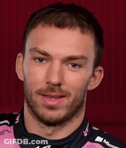 A Man With A Beard Is Wearing A Pink Shirt That Says Microsoft On It GIF