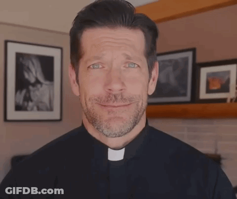 A Man With A Beard Is Wearing A Priest Collar And Making A Funny Face GIF