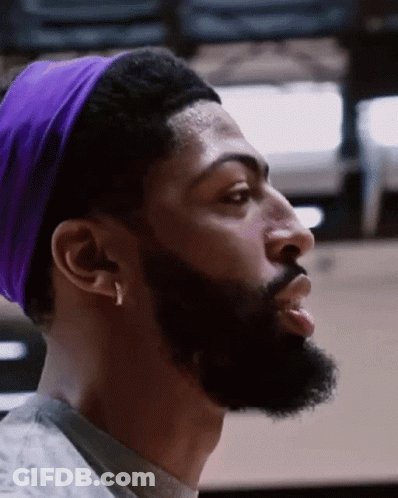 A Man With A Beard Is Wearing A Purple Headband GIF