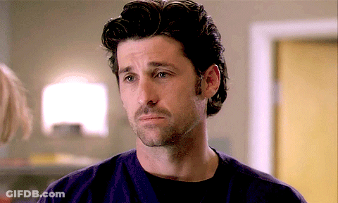 A Man With A Beard Is Wearing A Purple Shirt And A Black Shirt GIF