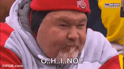 A Man With A Beard Is Wearing A Red Hat And A Sweatshirt And Says O.h.i. No ! GIF