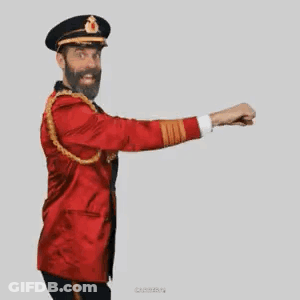 A Man With A Beard Is Wearing A Red Jacket And Hat And Is Dancing . GIF
