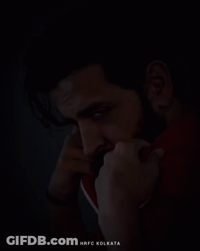 A Man With A Beard Is Wearing A Red Jacket And The Word Kolkata Is On The Bottom GIF