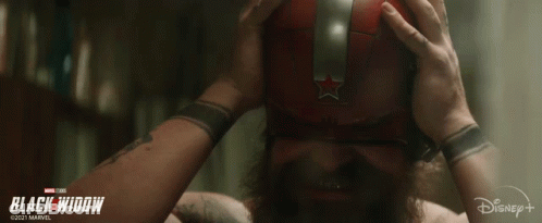 Man With Beard Wearing Red Mask And Silver Star GIF