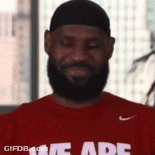 A Man With A Beard Is Wearing A Red T-Shirt That Says We Are . GIF