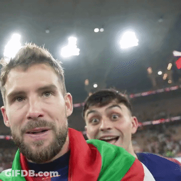 A Man With A Beard Is Wearing A Red White And Blue Jacket With The Word Adidas On The Front GIF