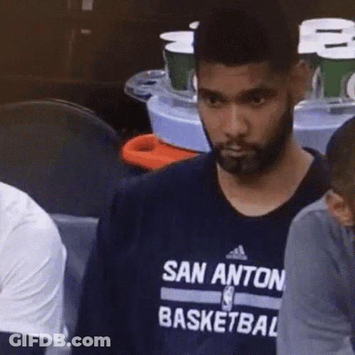 A Man With A Beard Is Wearing A San Anton Basketball Shirt GIF