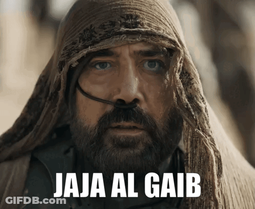 A Man With A Beard Is Wearing A Scarf Around His Head And The Words Jaja Al Gaib Are Above Him GIF