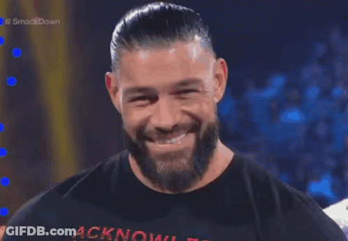 A Man With A Beard Is Wearing A Shirt That Says Acknowledgment GIF