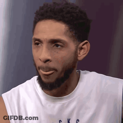 A Man With A Beard Is Wearing A Shirt That Says Ckc GIF