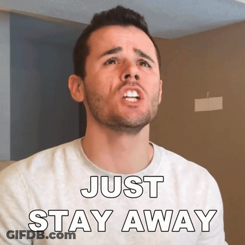 A Man With A Beard Is Wearing A Shirt That Says " Just Stay Away " GIF