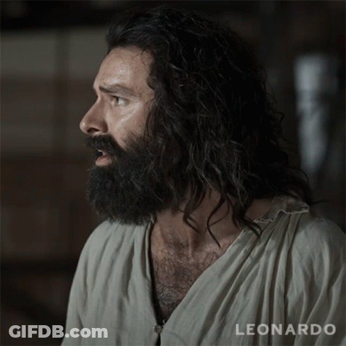 A Man With A Beard Is Wearing A Shirt That Says Leonardo On It GIF