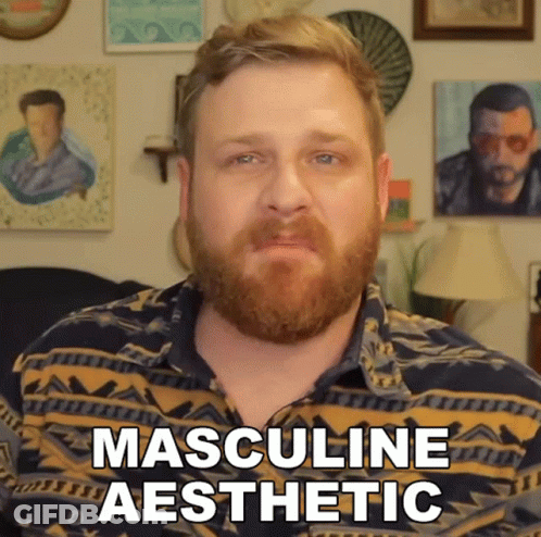 A Man With A Beard Is Wearing A Shirt That Says Masculine Aesthetic On It GIF