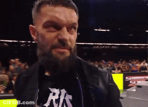 A Man With A Beard Is Wearing A Shirt That Says Rks GIF