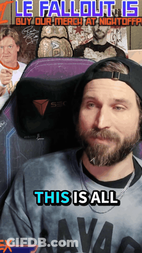 A Man With A Beard Is Wearing A Shirt That Says Savag On It GIF