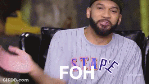 A Man With A Beard Is Wearing A Striped Shirt That Says ' Stape Foh ' On It . GIF