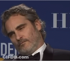 A Man With A Beard Is Wearing A Tuxedo And A Bow Tie . GIF