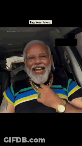 A Man With A Beard Is Wearing A Watch And A Gold Chain Around His Neck GIF