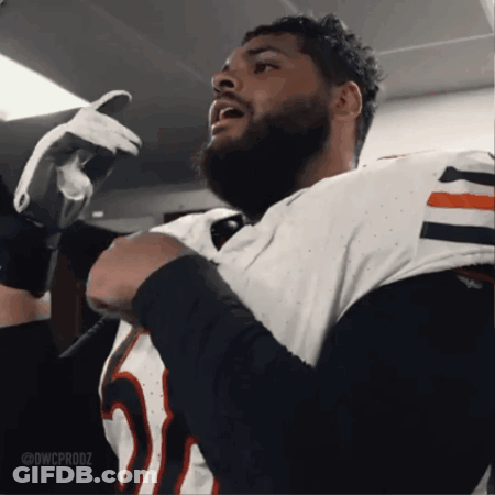 A Man With A Beard Is Wearing A White Jersey With The Number 25 On It GIF